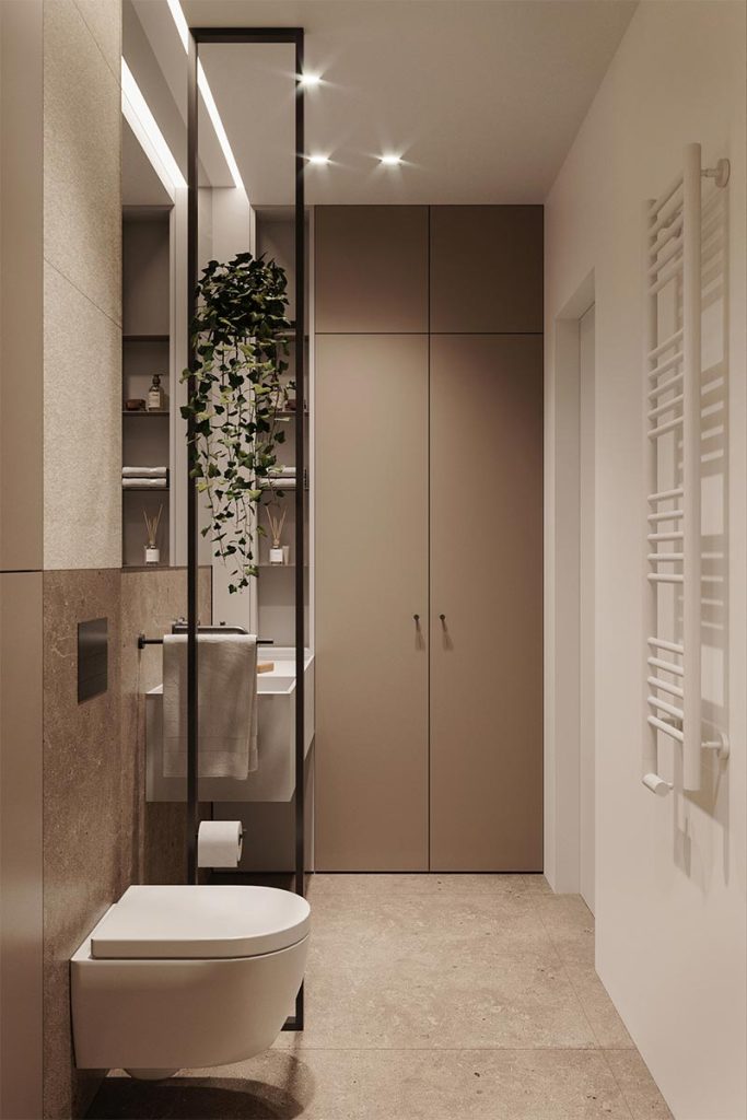 De inbouwkast bekleed de hele wand tot aan het plafond, met zowel dichte kasten als open vakken.