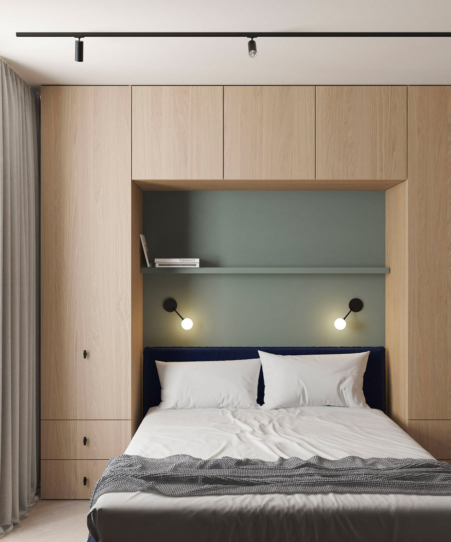 Ontwerper Emil Dervish heeft een super mooie kast op maat ontworpen aan de muur achter het bed in deze moderne kleine slaapkamer.